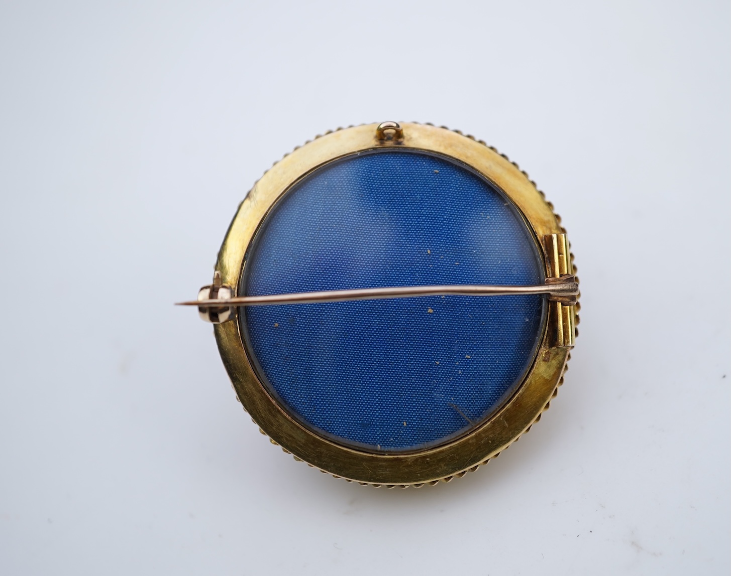 A Victorian gold and coral brooch, late 19th century